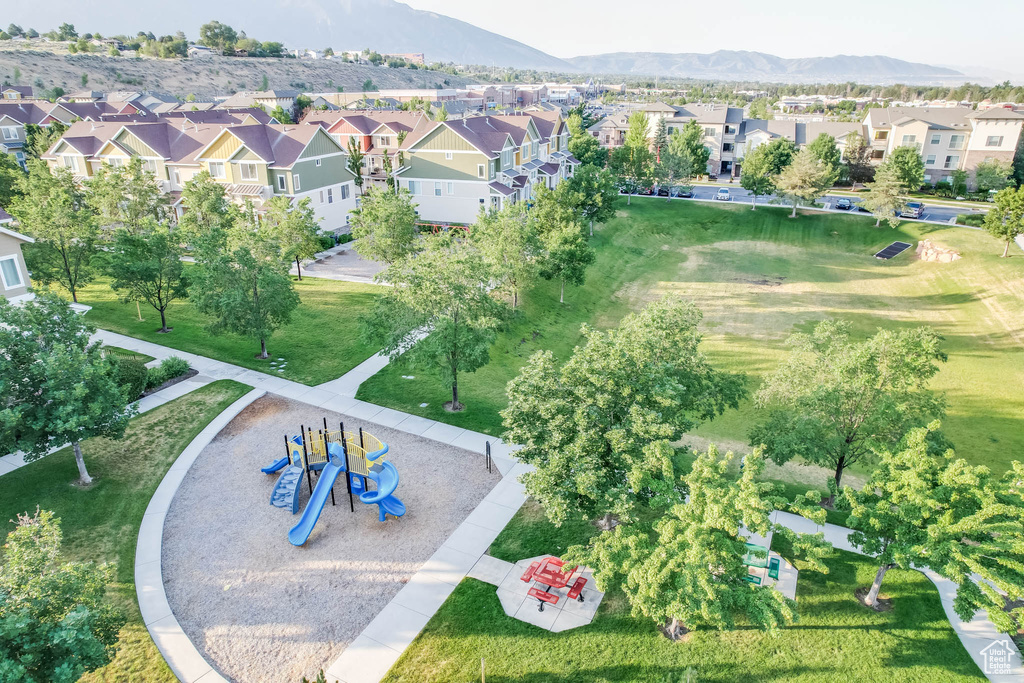 Aerial perspective of suburban area with mountains and a recreational park