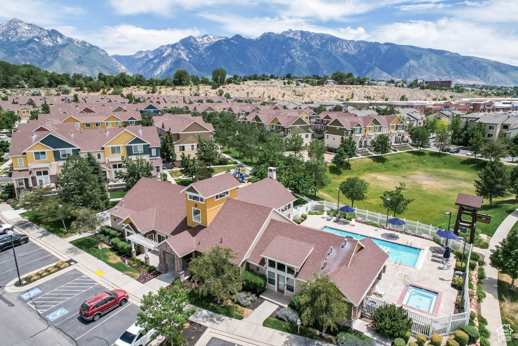 Aerial perspective of suburban area with a mountain backdrop