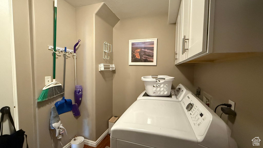 Laundry room with cabinet space and washing machine and dryer