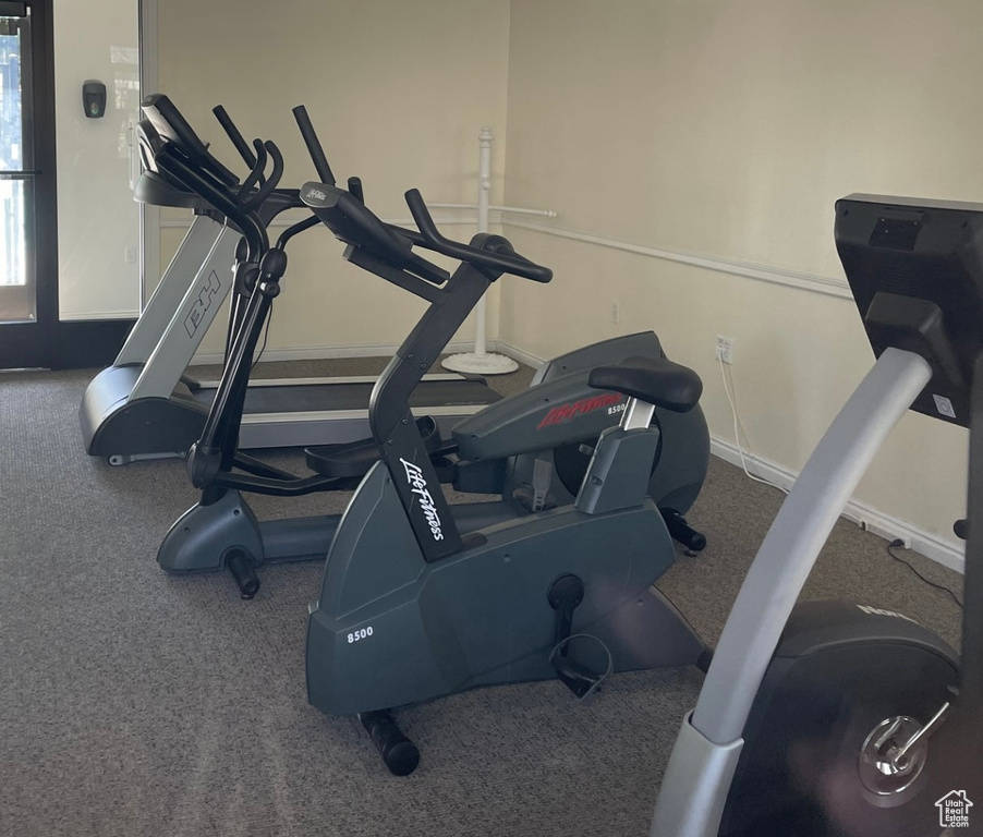 Gym with carpet and baseboards