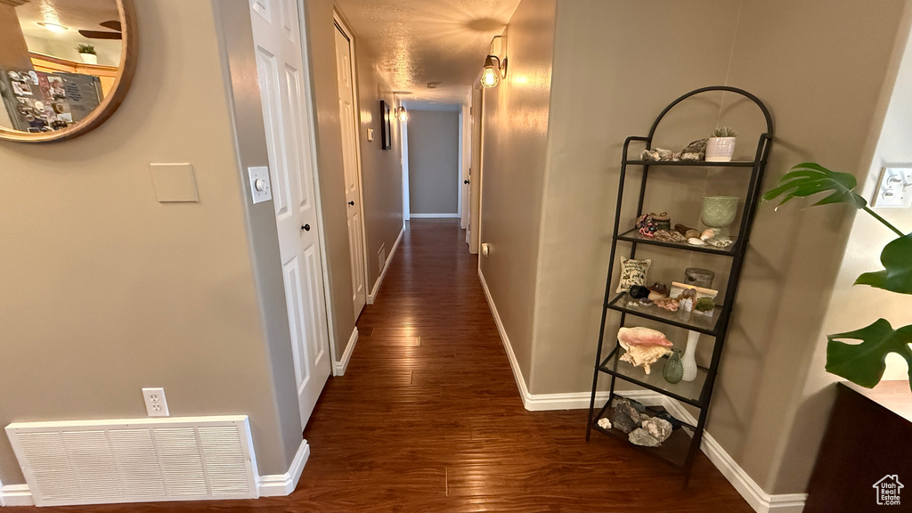 Hall featuring wood finished floors
