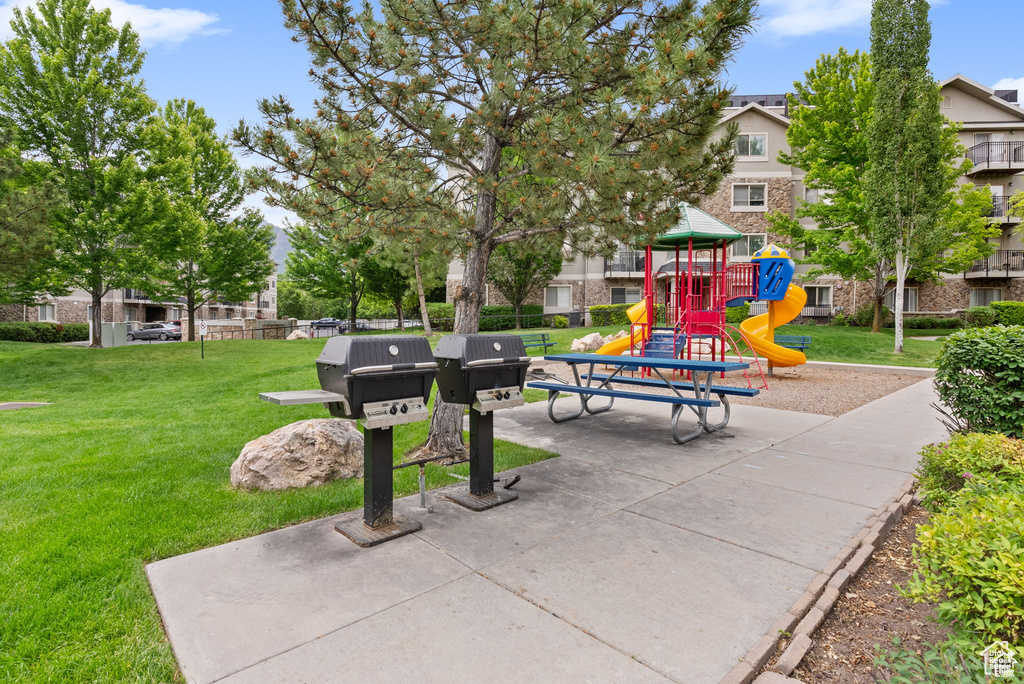View of home\'s community featuring a lawn