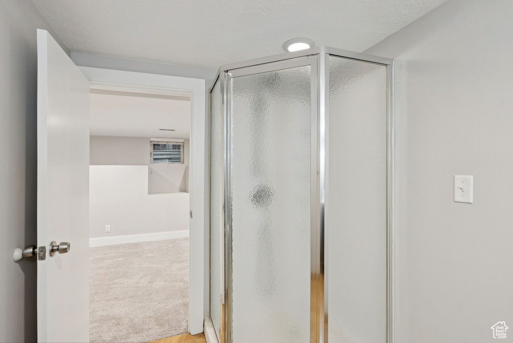 Full bathroom featuring a stall shower