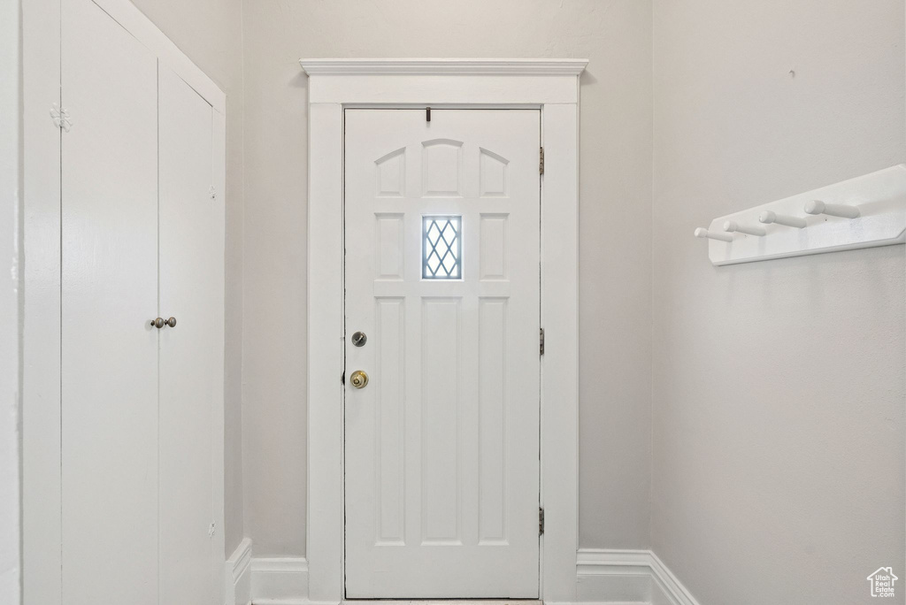 Entrance foyer featuring baseboards