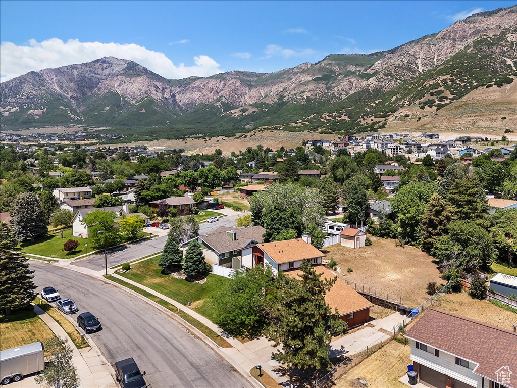 Aerial perspective of suburban area featuring a mountain backdrop