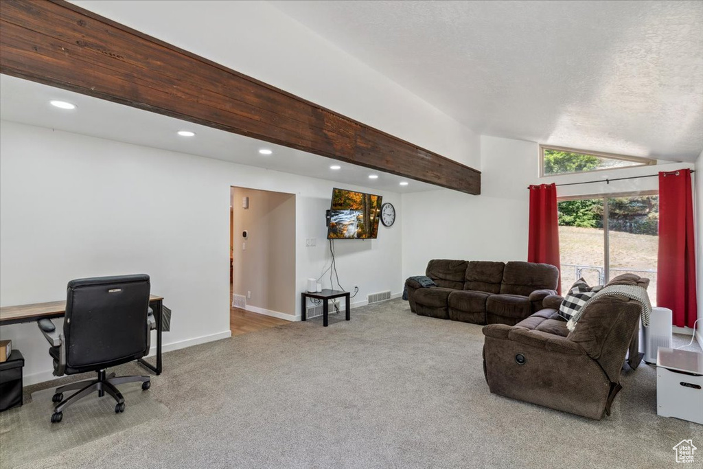 Living area featuring carpet, vaulted ceiling, an office area, and recessed lighting