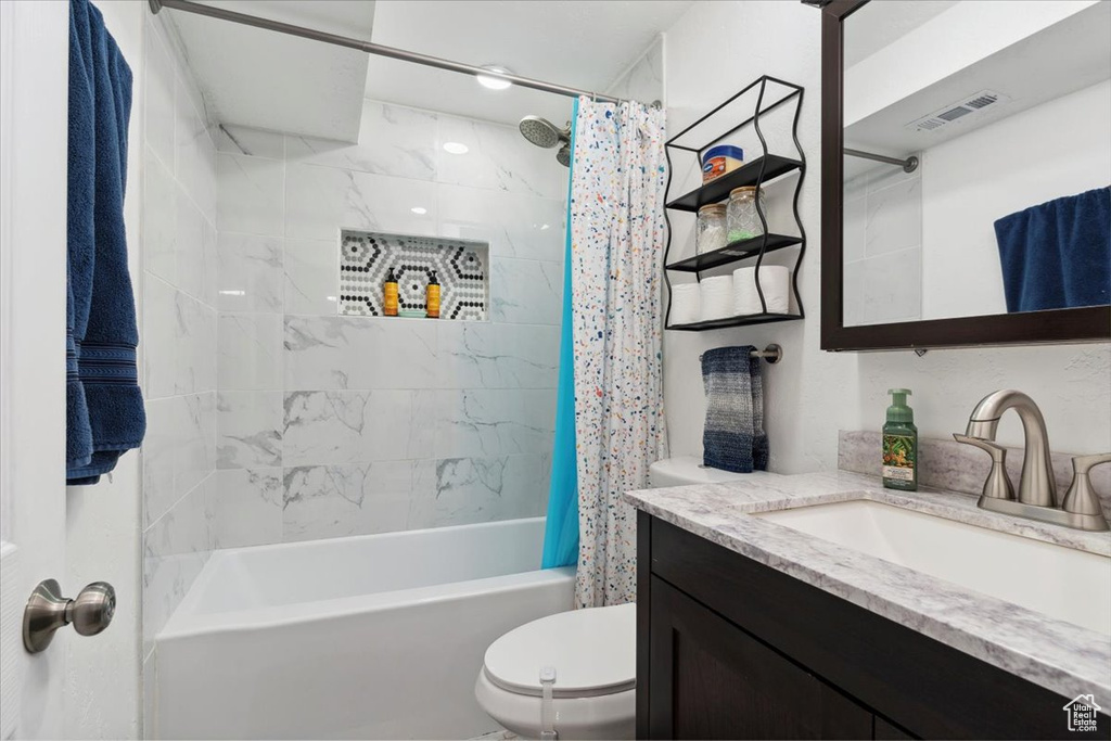 Full bathroom with vanity and shower / bath combo