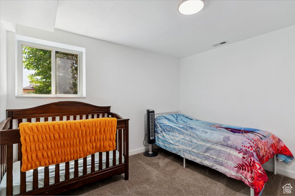 Bedroom with carpet and baseboards