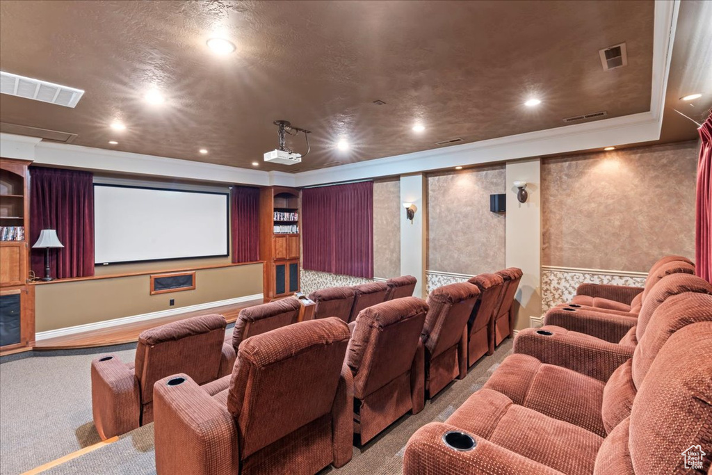 Carpeted home theater featuring baseboards and recessed lighting