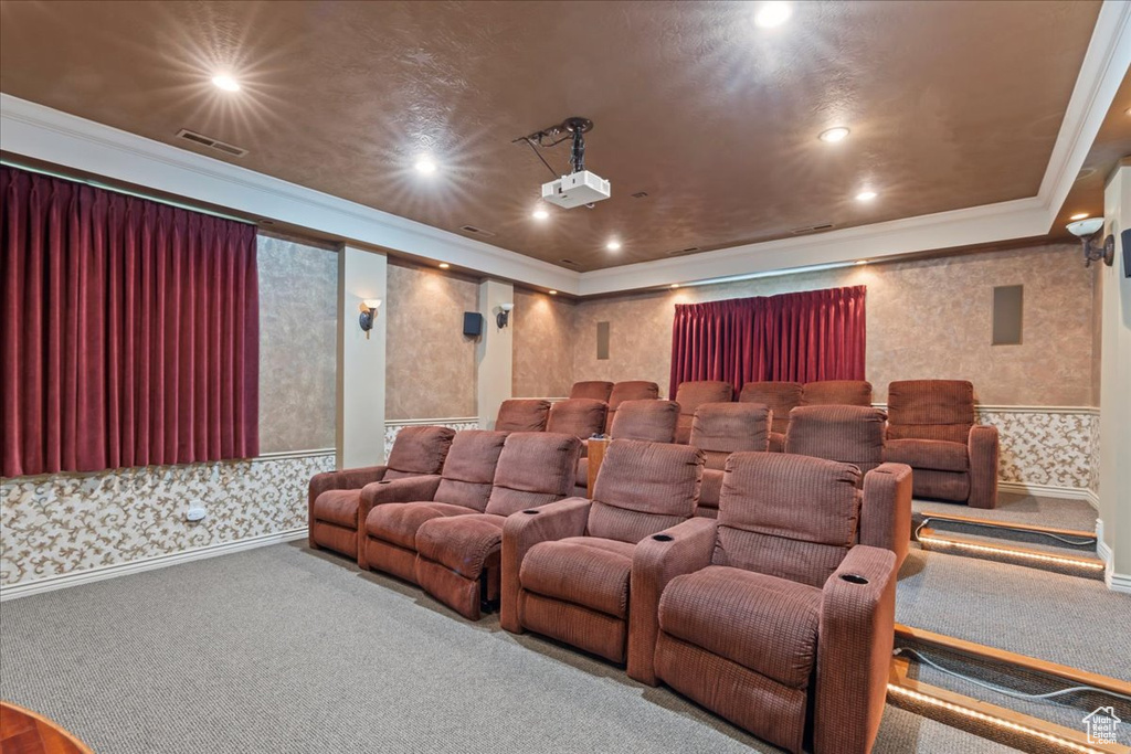 Carpeted cinema with wallpapered walls, crown molding, and recessed lighting
