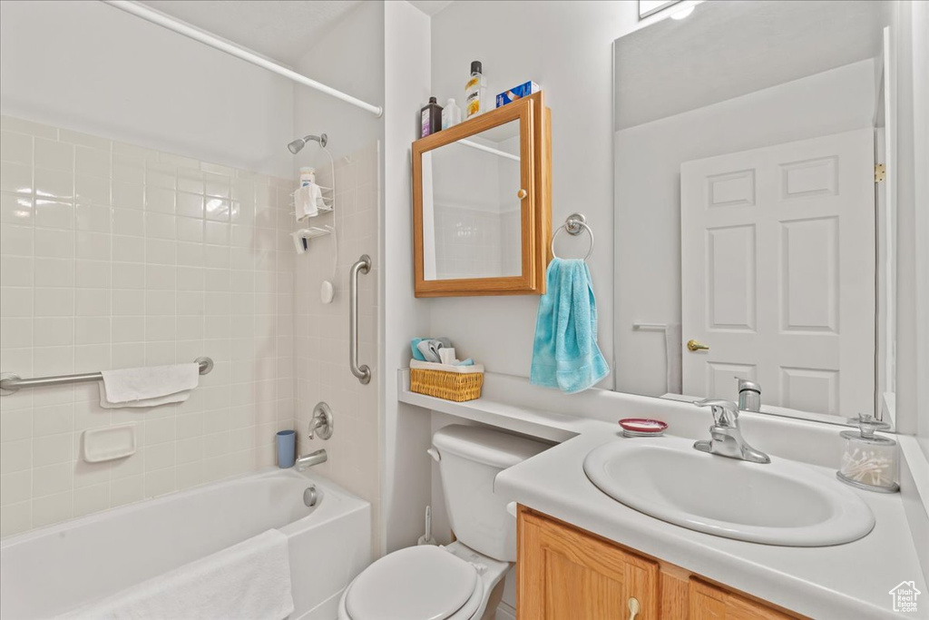 Full bathroom with shower / washtub combination and vanity