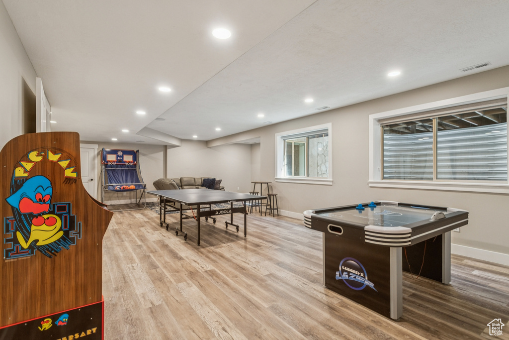 Game room featuring wood finished floors and recessed lighting