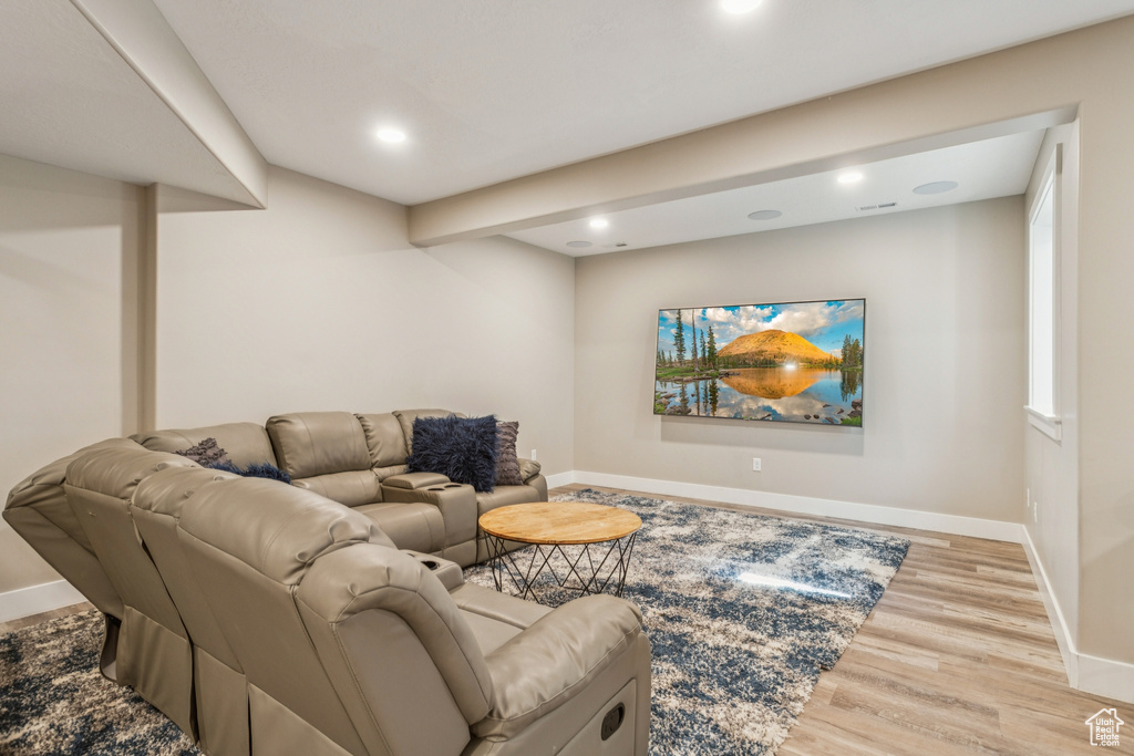 Living area featuring wood finished floors and recessed lighting