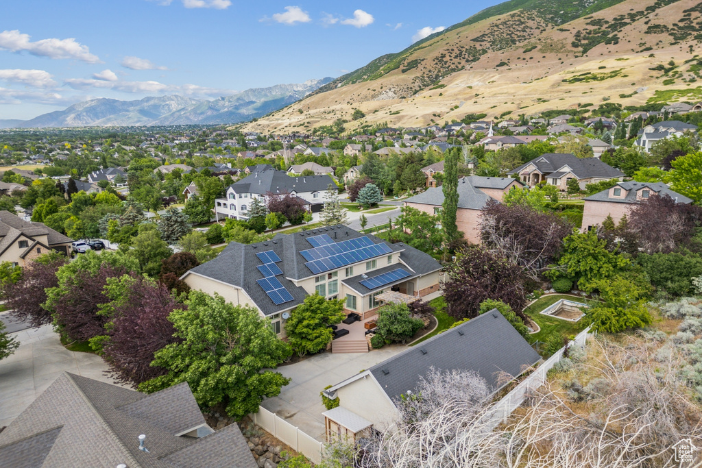 Aerial perspective of suburban area with a mountain backdrop