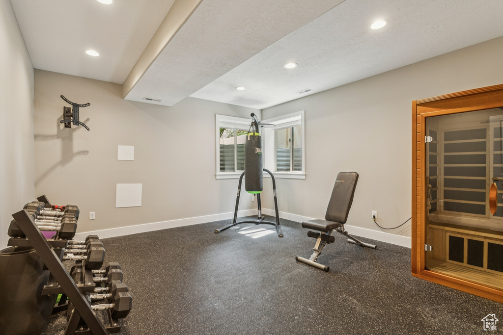 Exercise room featuring recessed lighting and baseboards