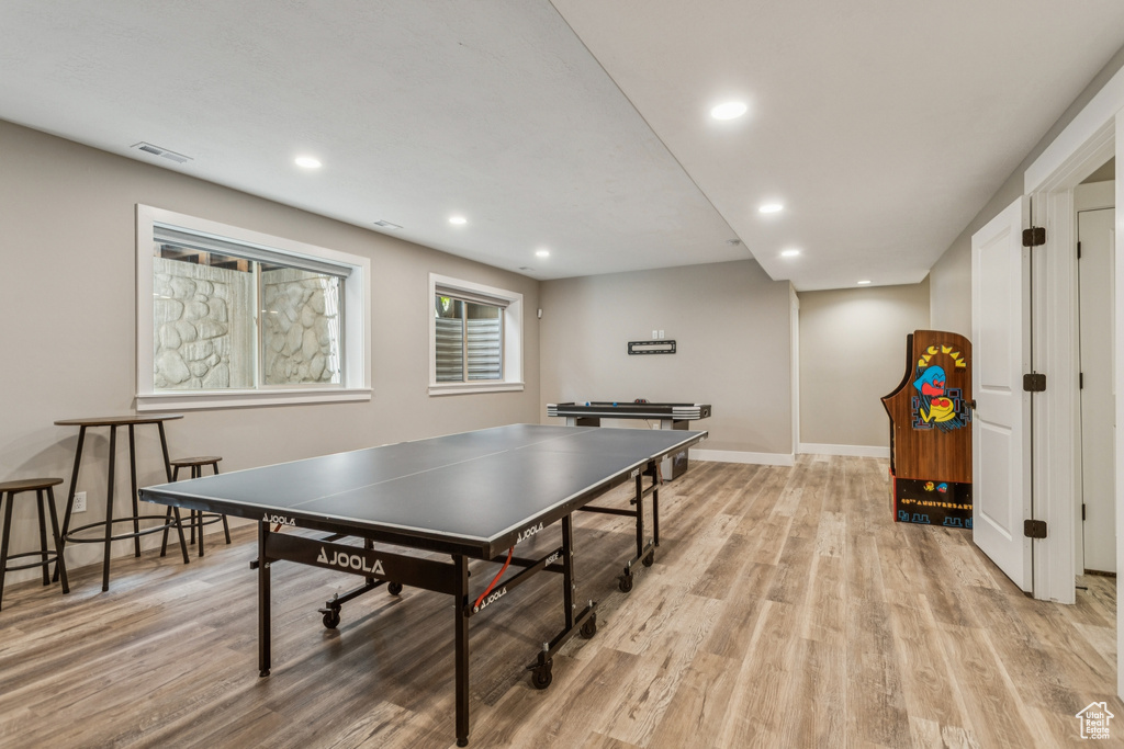 Recreation room featuring light wood-type flooring and recessed lighting