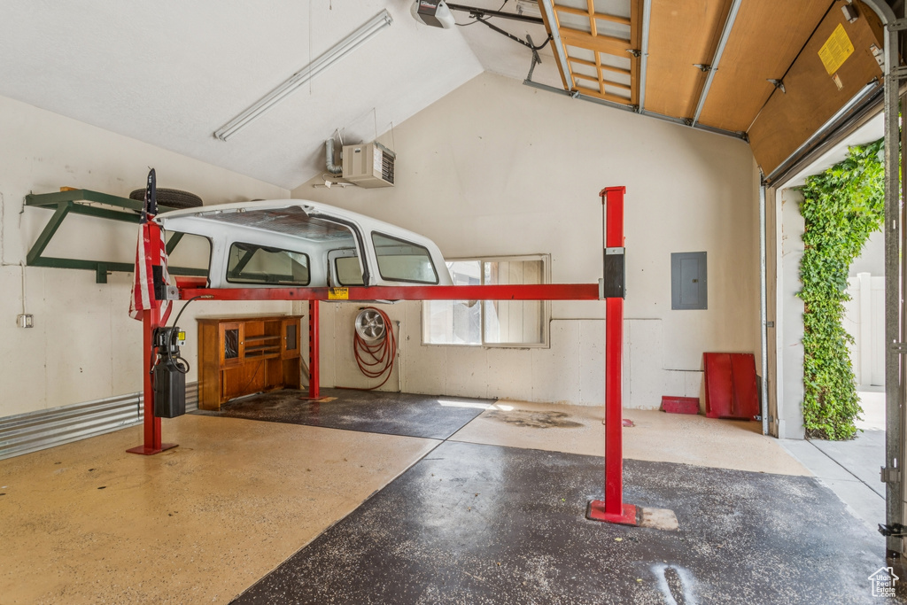 Garage with electric panel and a heating unit