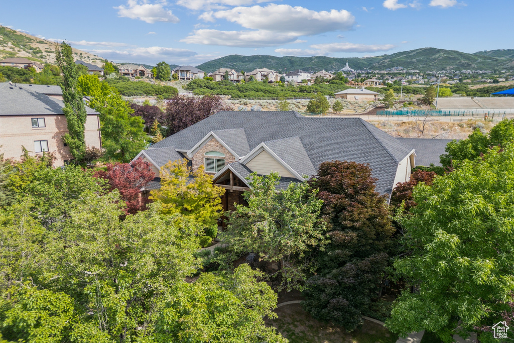 Aerial perspective of suburban area featuring a mountainous background