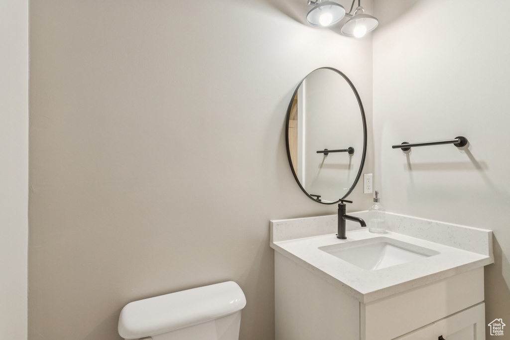 Bathroom with toilet and vanity