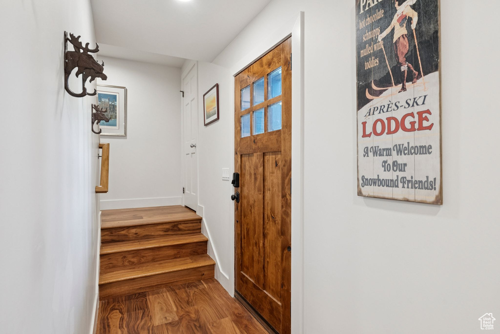 Entrance foyer featuring wood finished floors and stairs