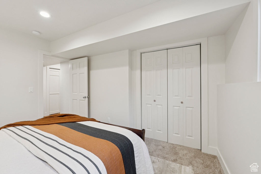 Bedroom featuring carpet flooring, a closet, and recessed lighting