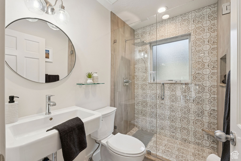 Full bathroom with a shower stall