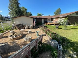 Back of property featuring a vegetable garden
