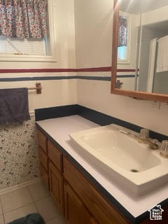 Bathroom with vanity and tile patterned floors