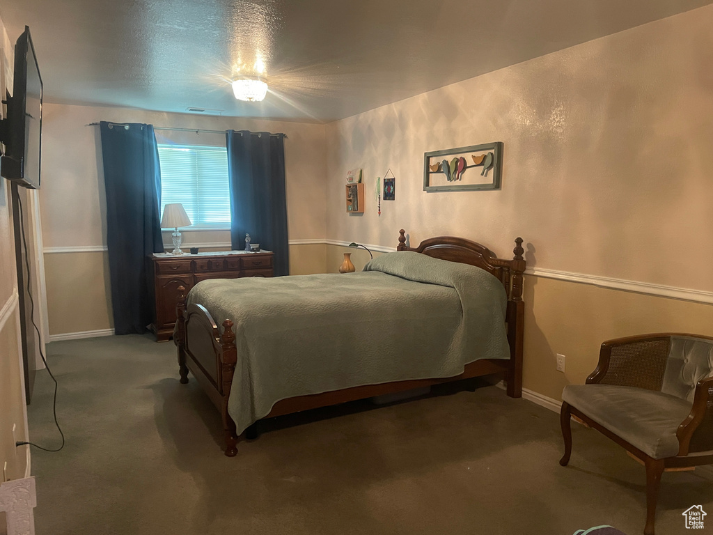 Bedroom featuring light colored carpet