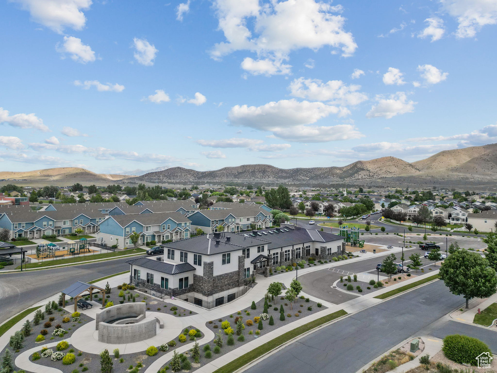 Aerial perspective of suburban area with a mountainous background