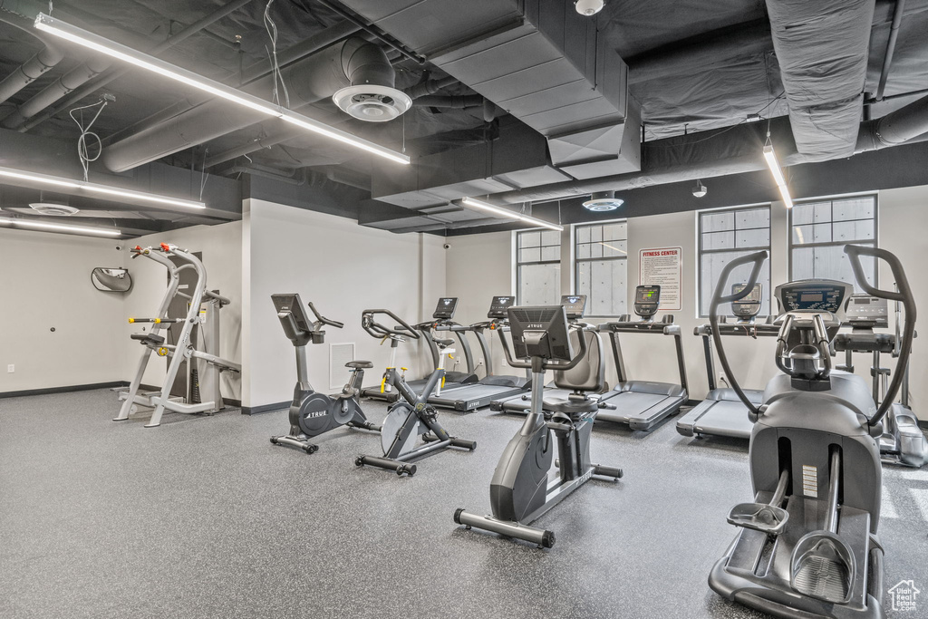 Workout area featuring baseboards