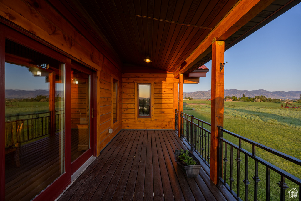Deck with a view of rural / pastoral area and a mountain view