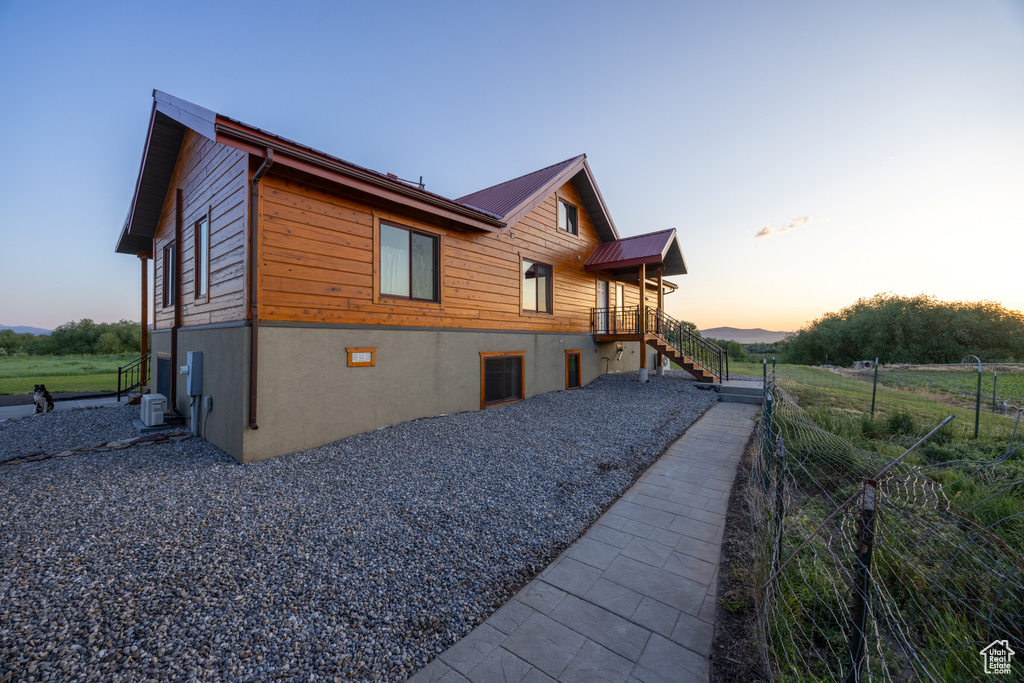 View of property exterior at dusk