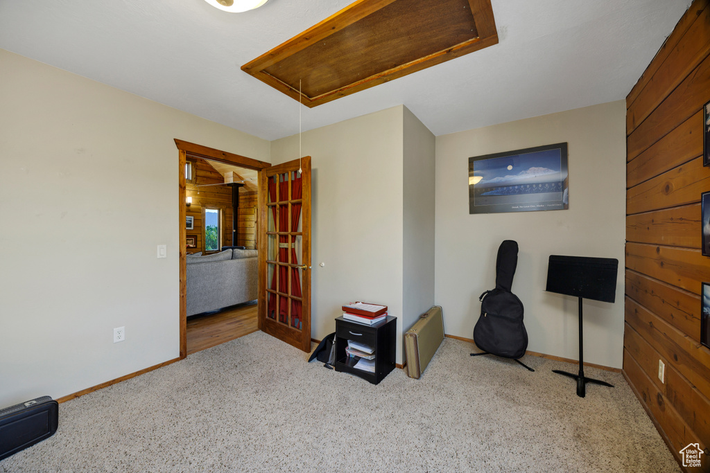 Bedroom with attic access and carpet floors
