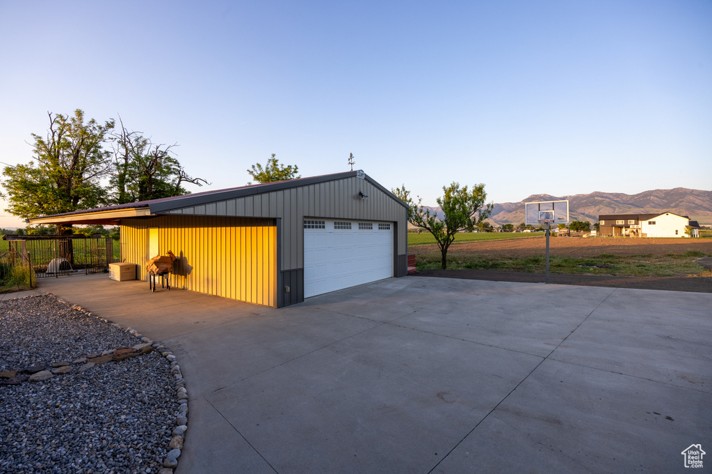 Detached garage with a mountain view