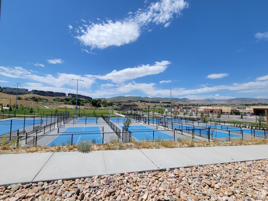 View of tennis court featuring a mountain view