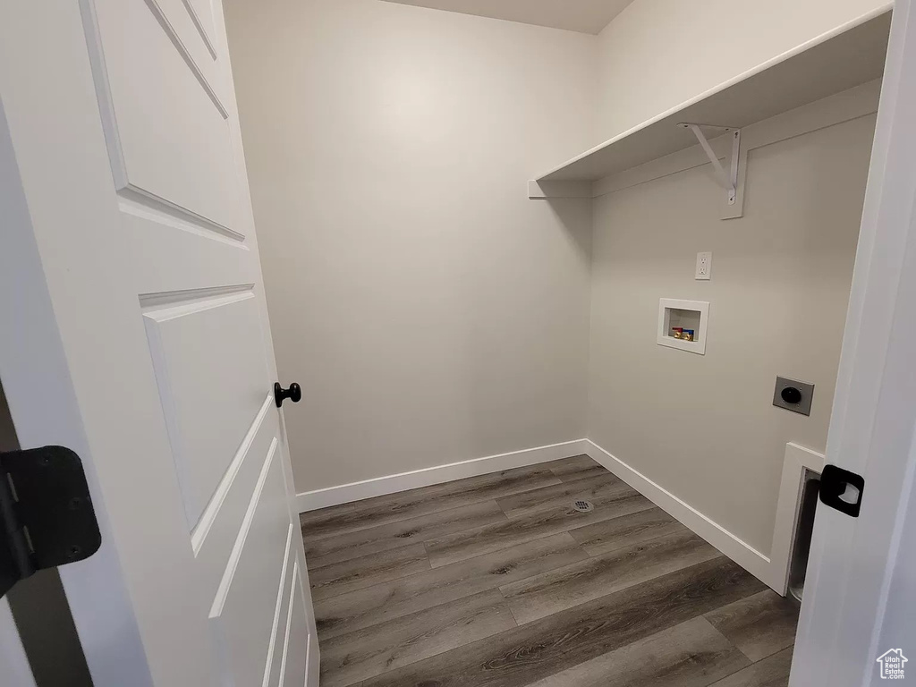 Laundry room featuring hookup for a washing machine, dark wood-style floors, and hookup for an electric dryer