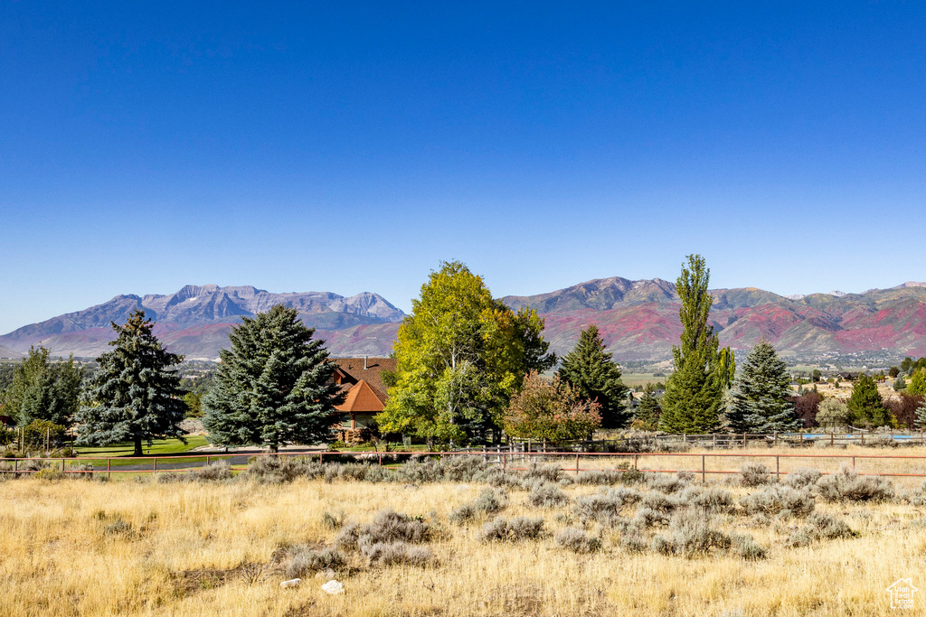 View of mountain backdrop with rural landscape