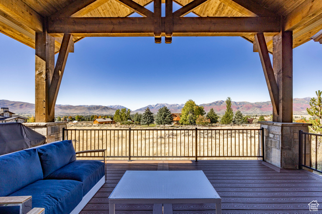 Wooden terrace with a mountain view and outdoor lounge area