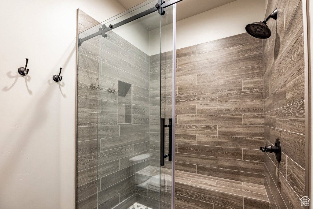 Full bathroom with a shower stall