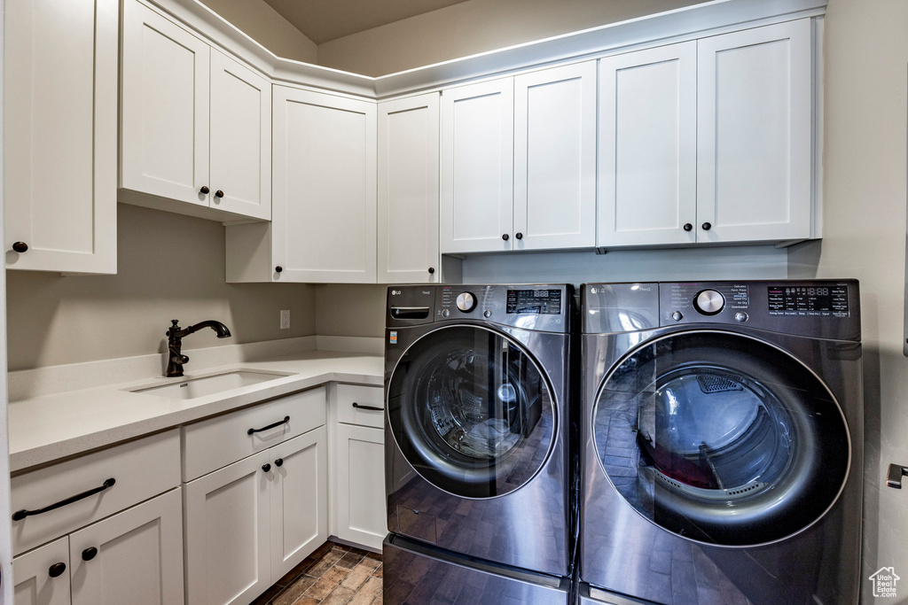 Laundry area with cabinet space and washer and dryer