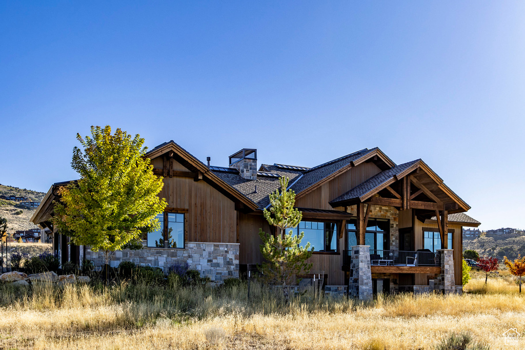 View of front of house featuring stone siding