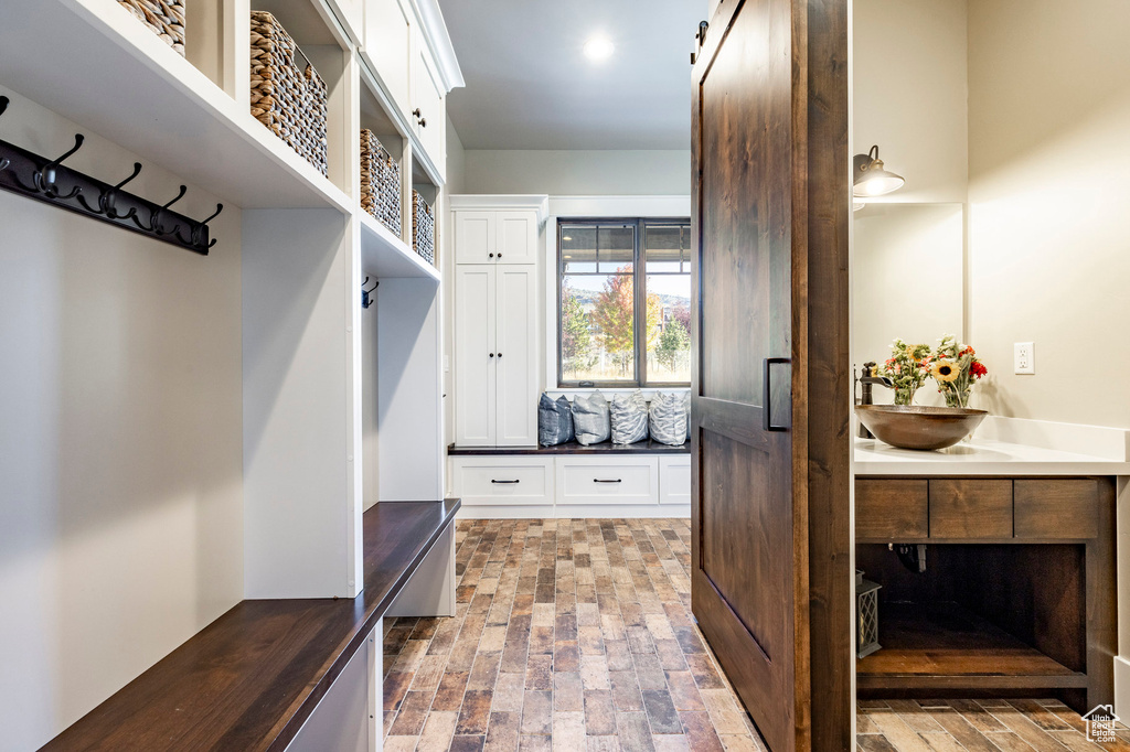 Mudroom featuring brick patterned flooring