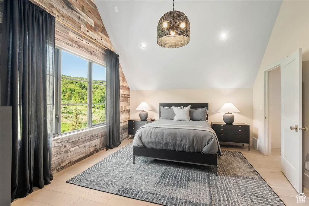 Bedroom featuring vaulted ceiling
