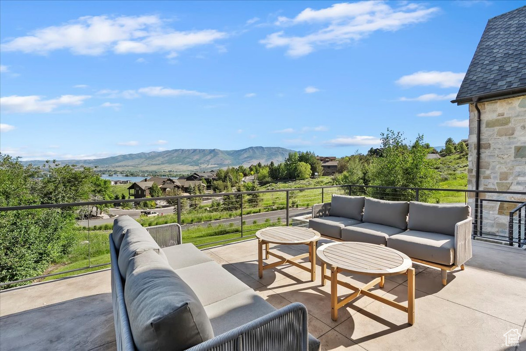 Patio / terrace featuring outdoor lounge area and a mountain view