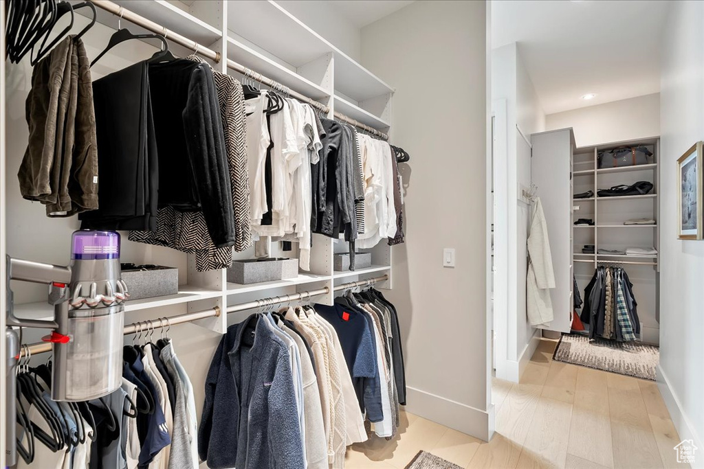 Walk in closet featuring wood finished floors