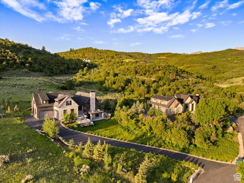 View from above of property featuring a heavily wooded area