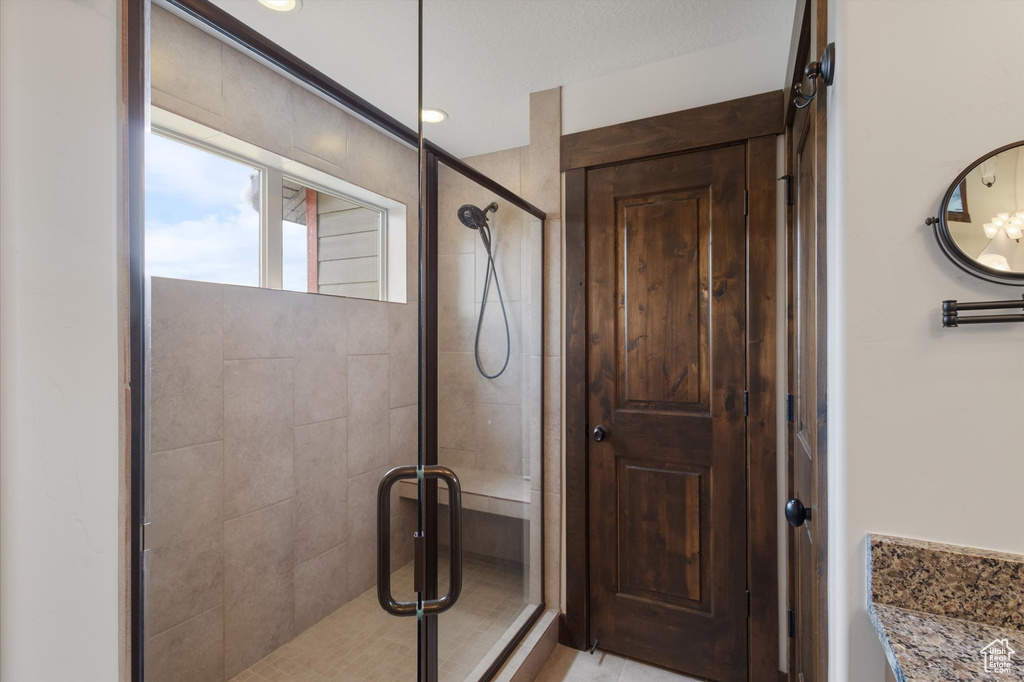 Bathroom with a stall shower and vanity