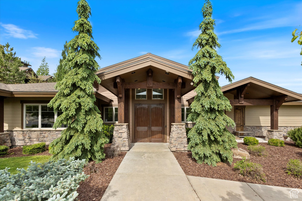 Doorway to property with stone siding