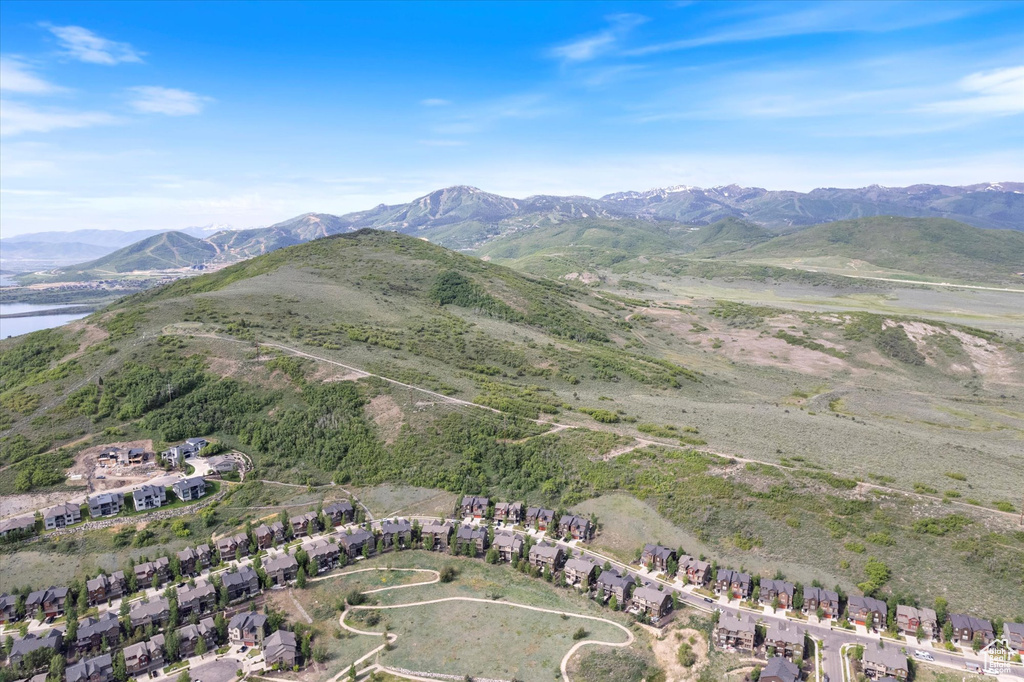 View of mountain backdrop featuring nearby suburban area